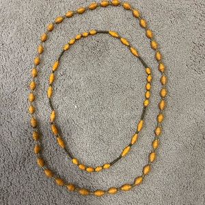 Two yellow paper bead necklaces, mustard yellow